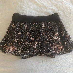 black and gold patterned LULU LEMON tennis skirt
